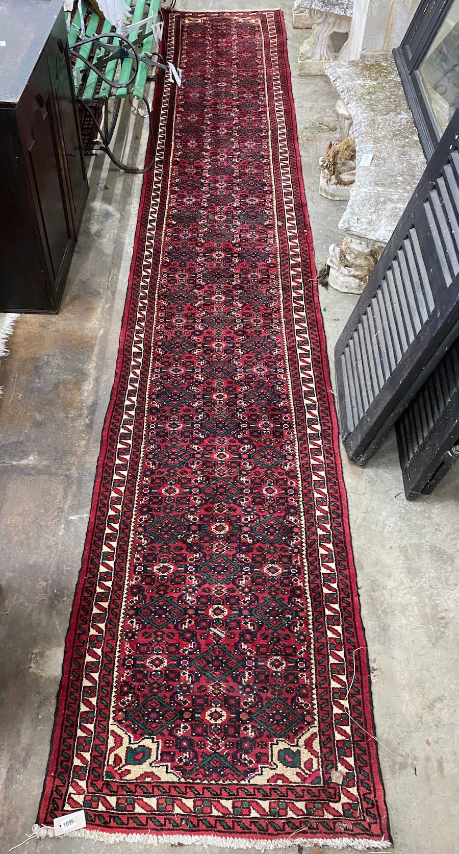 A North West Persian red ground runner, 480 x 80cm